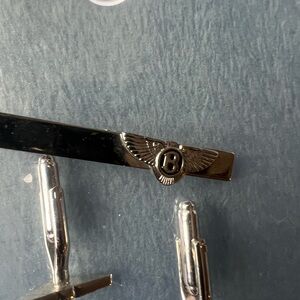 Elegant Silver Cuff Links with Winged Emblem